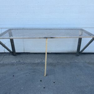 Perforated stainless steel wall mounted table